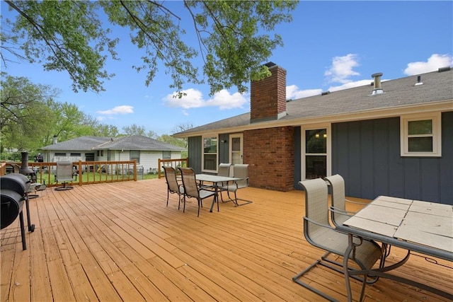  - wooden deck featuring outdoor dining space