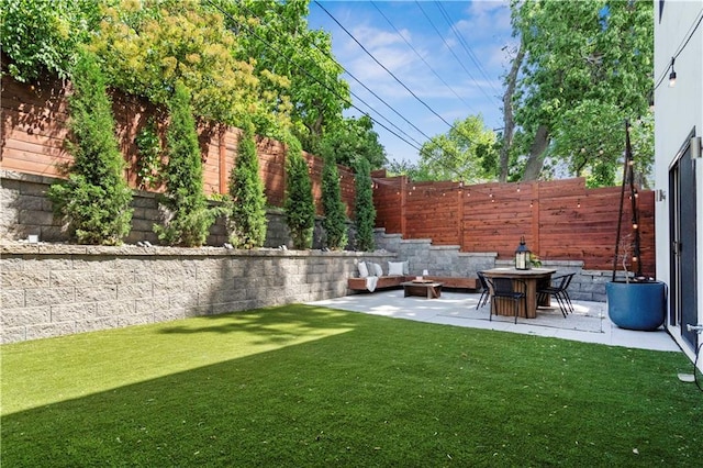 4727 Liberty St, Kansas City, MO 64112 - view of yard with a patio area and a fire pit
