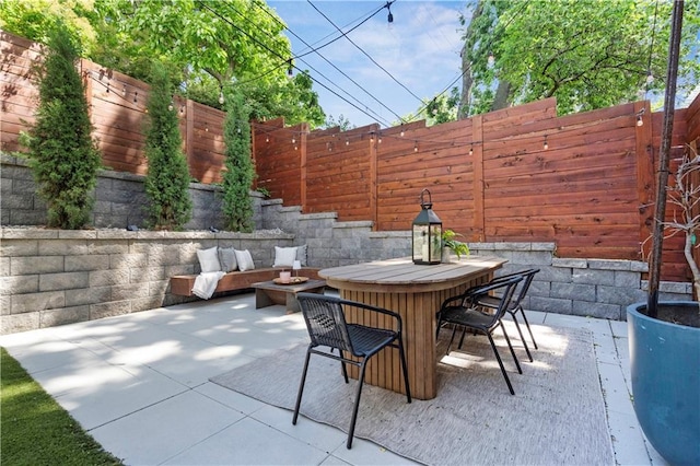 4727 Liberty St, Kansas City, MO 64112 - view of patio / terrace with a fenced backyard and outdoor dining area