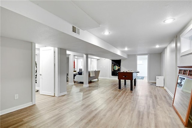 recreation room featuring light wood-style flooring, baseboards, and recessed lighting