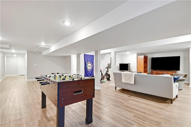 recreation room featuring light wood-style floors, baseboards, and recessed lighting