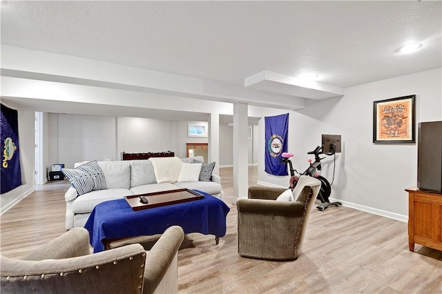 living room featuring light wood-style flooring and baseboards