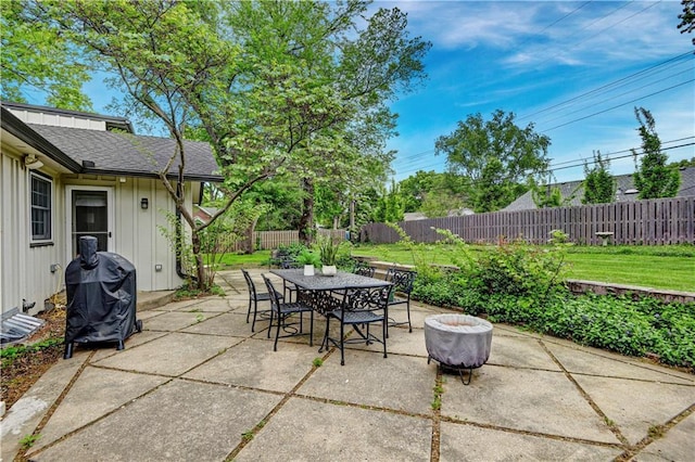 view of patio / terrace featuring area for grilling, a fenced backyard, and outdoor dining area