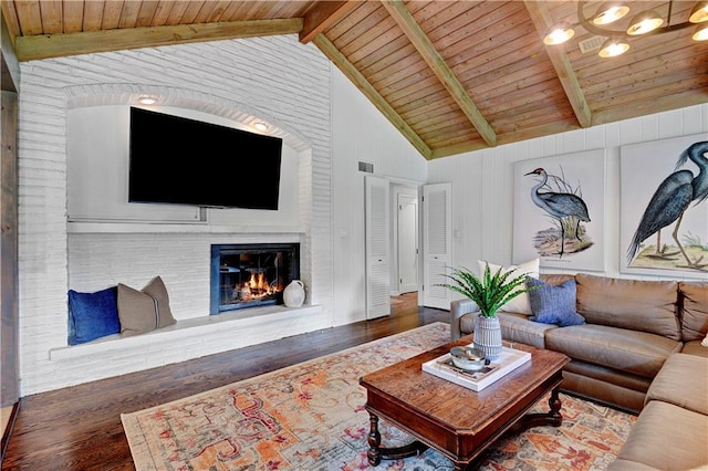 living area with wood finished floors, wooden ceiling, and a fireplace