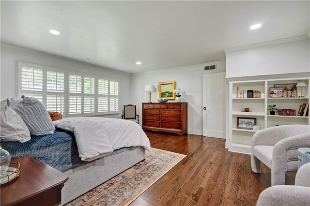 bedroom with ornamental molding, wood finished floors, recessed lighting, and baseboards