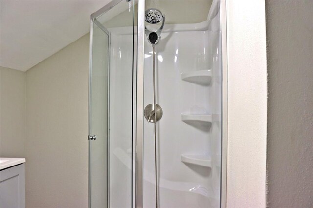 3417 Jackson Ave, Kansas City, MO 64128 - bathroom with vanity and a stall shower