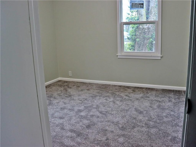 3417 Jackson Ave, Kansas City, MO 64128 - carpeted spare room with baseboards and visible vents