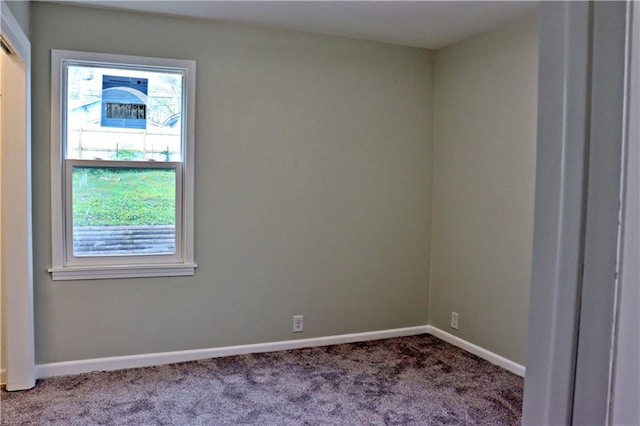 3417 Jackson Ave, Kansas City, MO 64128 - carpeted spare room with baseboards
