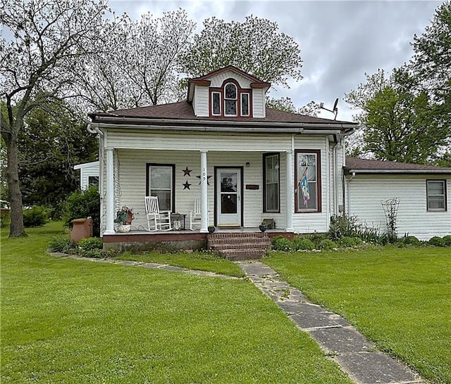 109 S State Route F, Garden City, MO 64747 - bungalow featuring a porch and a front yard