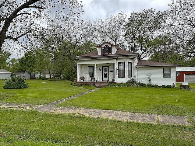 109 S State Route F, Garden City, MO 64747 - bungalow featuring a porch and a front yard