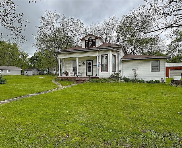109 S State Route F, Garden City, MO 64747 - view of front of house featuring a porch and a front yard