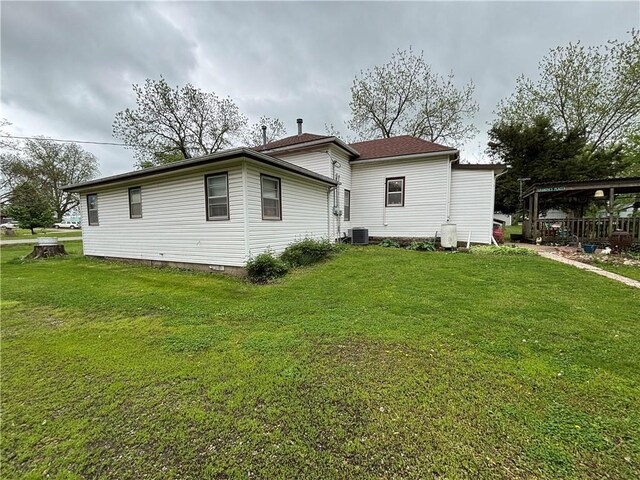109 S State Route F, Garden City, MO 64747 - rear view of house with a lawn, central AC, and crawl space