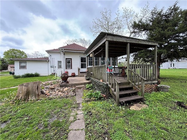 109 S State Route F, Garden City, MO 64747 - back of house with a yard and a wooden deck