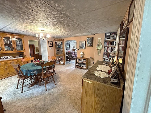 109 S State Route F, Garden City, MO 64747 - dining space featuring an inviting chandelier and light carpet