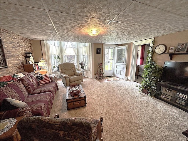 109 S State Route F, Garden City, MO 64747 - carpeted living area featuring brick wall