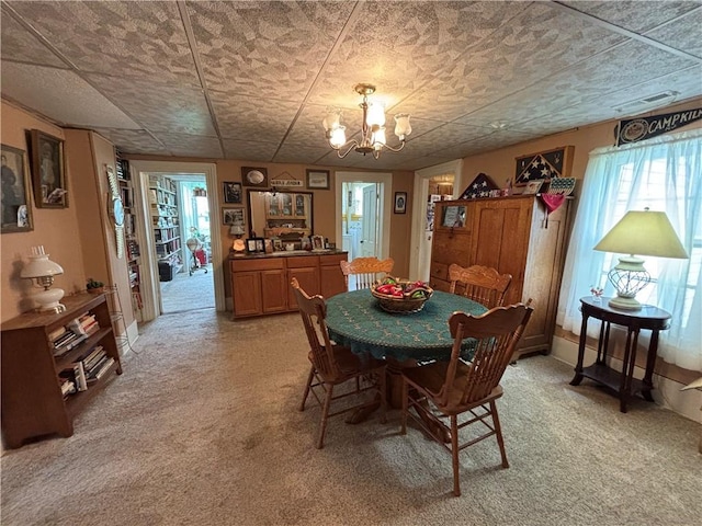 109 S State Route F, Garden City, MO 64747 - dining area with visible vents, light carpet, and a notable chandelier