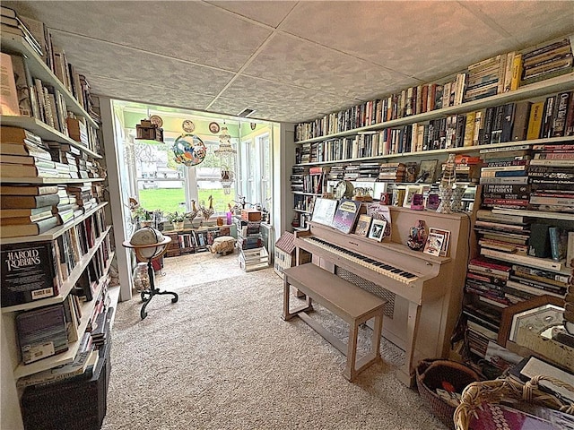 109 S State Route F, Garden City, MO 64747 - interior space featuring carpet floors and wall of books