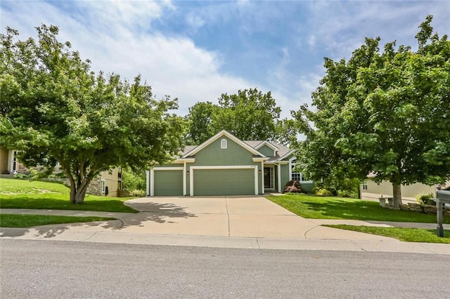 view of front of property featuring a garage, a front lawn, driveway, and stucco siding