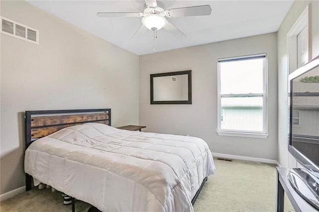 bedroom featuring carpet, baseboards, and a ceiling fan