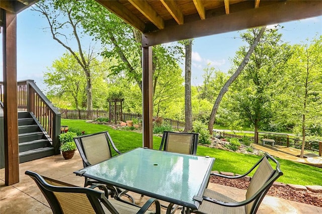 view of patio / terrace with outdoor dining area and stairs