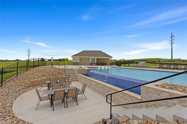 13610 NE 114th Pl, Kearney, MO 64060 - community pool with a patio area, an outbuilding, and outdoor dining space