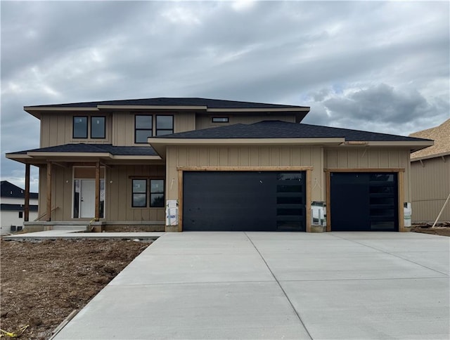 13610 NE 114th Pl, Kearney, MO 64060 - prairie-style house with a garage, driveway, a shingled roof, and board and batten siding