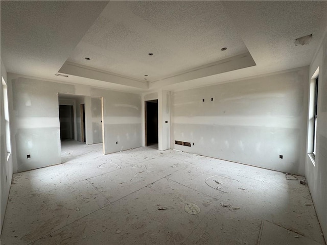 13610 NE 114th Pl, Kearney, MO 64060 - spare room with a tray ceiling and a textured ceiling