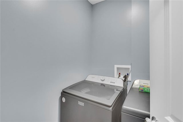 clothes washing area with washer / dryer and laundry area