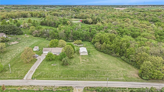 aerial view of property's location with a heavily wooded area
