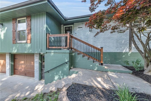 213 Lake Village Blvd, Blue Springs, MO 64014 - exterior space featuring an attached garage, concrete driveway, and brick siding