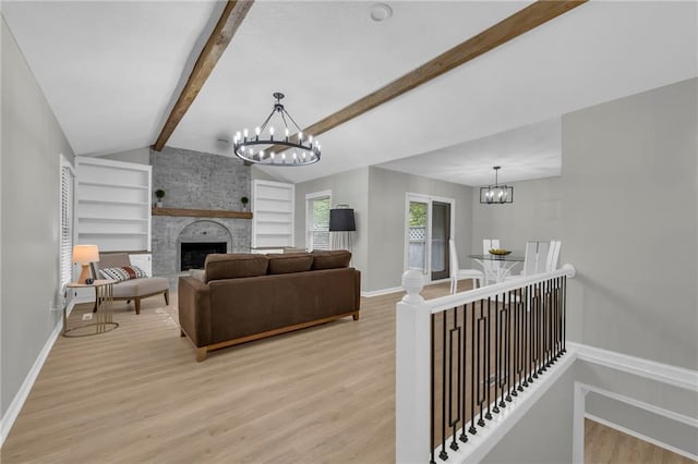213 Lake Village Blvd, Blue Springs, MO 64014 - living room with baseboards, vaulted ceiling with beams, light wood finished floors, and a notable chandelier