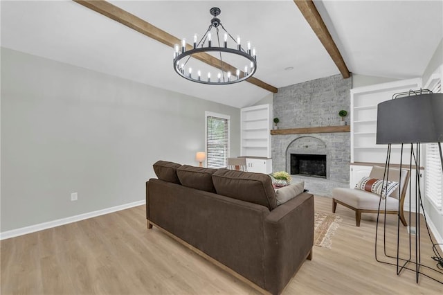 213 Lake Village Blvd, Blue Springs, MO 64014 - living area with a fireplace, baseboards, light wood-style floors, lofted ceiling with beams, and a notable chandelier
