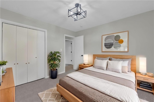213 Lake Village Blvd, Blue Springs, MO 64014 - carpeted bedroom with an inviting chandelier, baseboards, and a closet