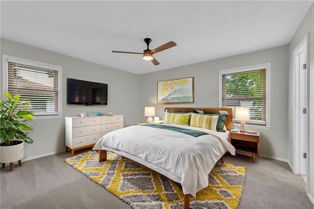 213 Lake Village Blvd, Blue Springs, MO 64014 - bedroom with baseboards, ceiling fan, and light carpet