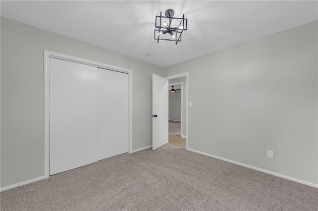 213 Lake Village Blvd, Blue Springs, MO 64014 - unfurnished bedroom with carpet floors, baseboards, and a closet