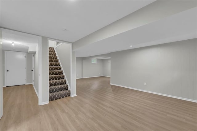 213 Lake Village Blvd, Blue Springs, MO 64014 - finished below grade area with light wood-style floors, baseboards, and stairs
