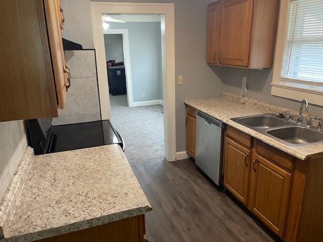 2120 68th Ter, Kansas City, MO 64132 - kitchen with stainless steel dishwasher, a sink, brown cabinets, and light countertops