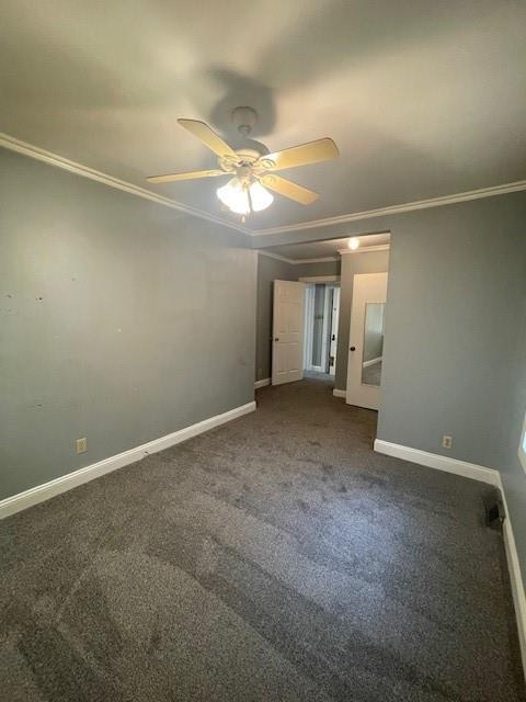 2120 68th Ter, Kansas City, MO 64132 - unfurnished bedroom featuring crown molding, baseboards, ceiling fan, and carpet