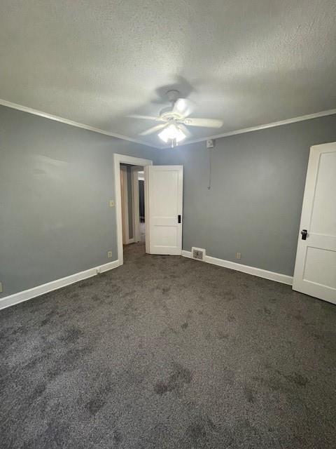2120 68th Ter, Kansas City, MO 64132 - empty room featuring ceiling fan, ornamental molding, a textured ceiling, and visible vents