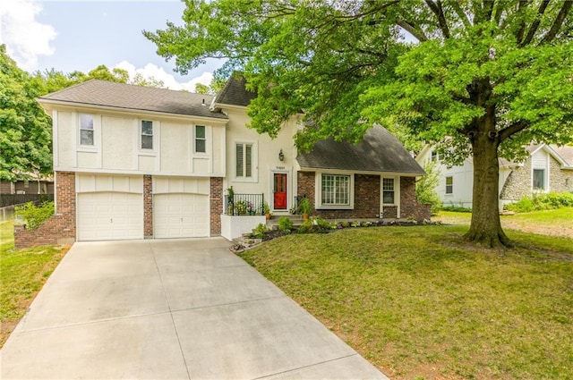 11801 Avila Dr, Kansas City, MO 64114 - split level home featuring brick siding, concrete driveway, a front yard, and an attached garage