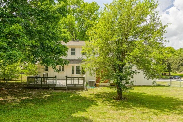 11801 Avila Dr, Kansas City, MO 64114 - view of yard with a wooden deck