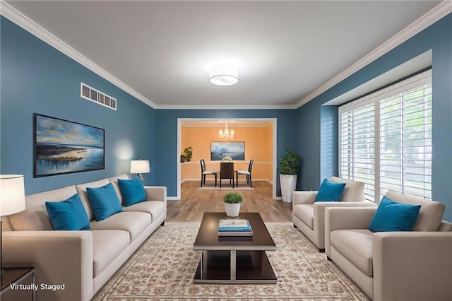 11801 Avila Dr, Kansas City, MO 64114 - living room featuring ornamental molding, a chandelier, and wood finished floors