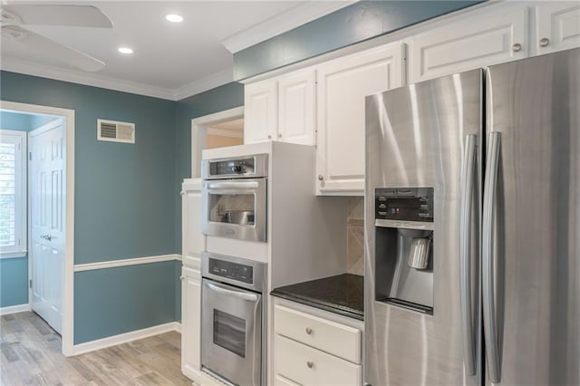 11801 Avila Dr, Kansas City, MO 64114 - kitchen with stainless steel appliances, crown molding, light wood-type flooring, a ceiling fan, and white cabinetry