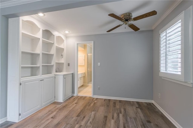 11801 Avila Dr, Kansas City, MO 64114 - unfurnished bedroom featuring light wood-style flooring, ornamental molding, ensuite bathroom, and recessed lighting