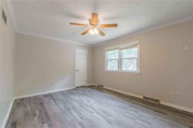11801 Avila Dr, Kansas City, MO 64114 - unfurnished room featuring a ceiling fan, wood finished floors, ornamental molding, and a textured ceiling