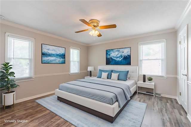 11801 Avila Dr, Kansas City, MO 64114 - bedroom with wood finished floors, multiple windows, crown molding, and a ceiling fan