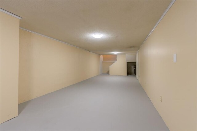 11801 Avila Dr, Kansas City, MO 64114 - finished basement featuring a textured ceiling