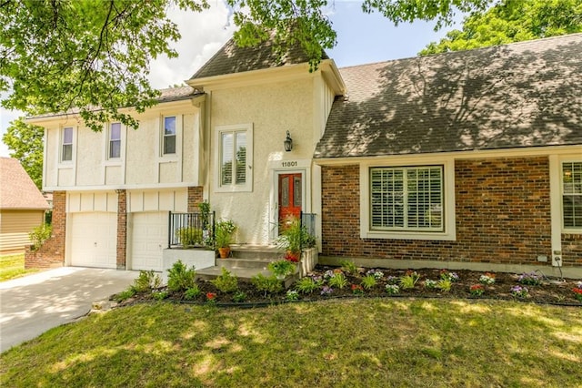 11801 Avila Dr, Kansas City, MO 64114 - view of front facade with brick siding, driveway, a front lawn, and roof with shingles