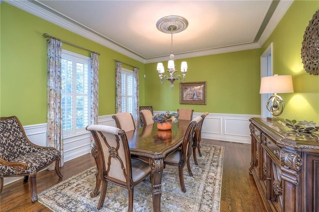 5701 W 148th Pl, Overland Park, KS 66223 - dining room with a chandelier, ornamental molding, dark wood-style flooring, a wainscoted wall, and a decorative wall