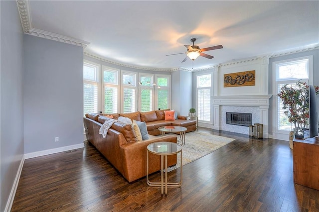 5701 W 148th Pl, Overland Park, KS 66223 - living area featuring ceiling fan, healthy amount of natural light, a fireplace, dark wood-type flooring, and ornamental molding